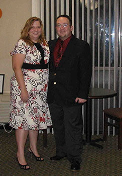 Dan and Wife Heather standing together for engagment an photo