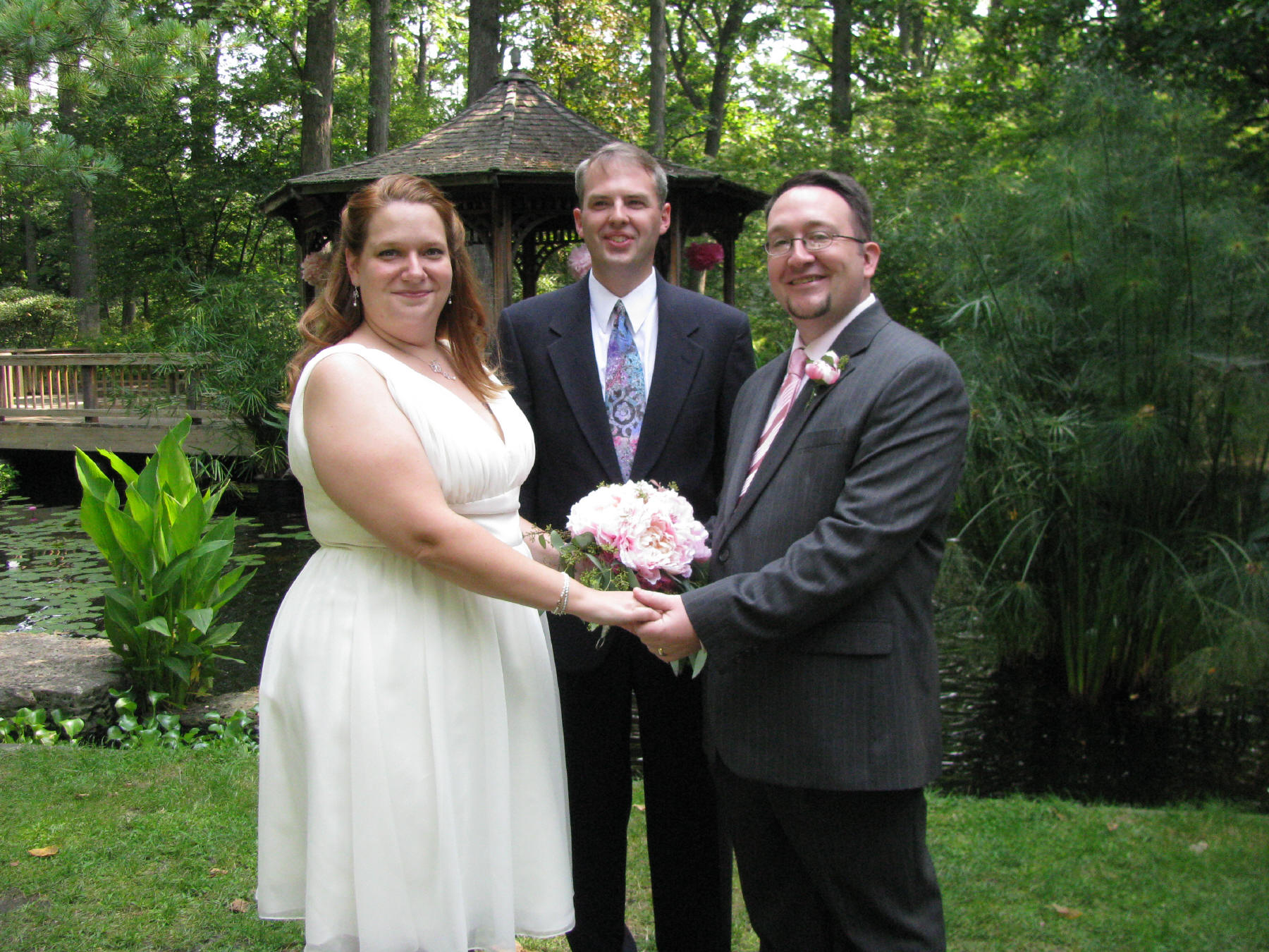 Dan and Wife Heather holding hands on their wedding day