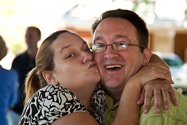 the author and his wife smiling