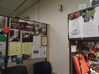 office cubicle with many photos
