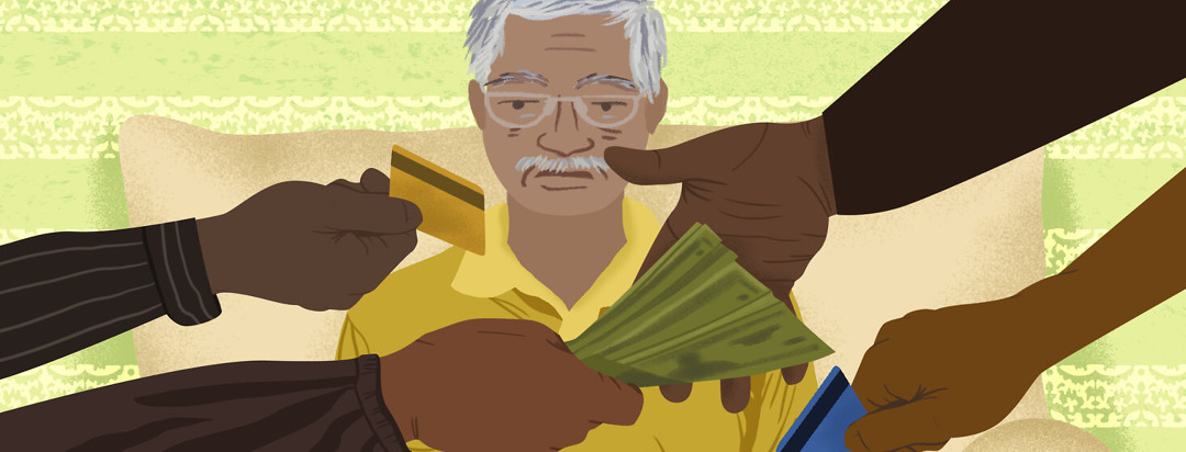 Father with gray hair and glasses sits as arms before him pass dollar bills and credit cards.