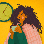 Person cozies up under blankets with coffee and clock behind them